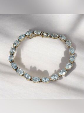 Gold-Tone Blue Topaz  Tennis Bracelet - Light Blue Elegance 7”